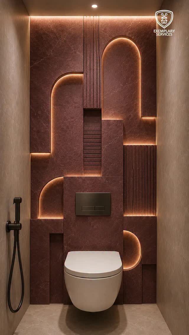 Geometric patterned reddish-brown accent wall with integrated LED lighting behind a white toilet.